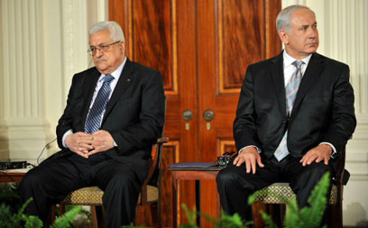 Prime Minister Benjamin Netanyahu and Palestinian President Mahmoud Abbas. 'Both sides are failing to internalize the ramifications of the bi-national state option' (Photo: AFP) 