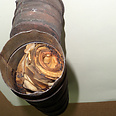 Scroll survives fire inside metal cylinder Photo courtesy of Shem Olam Institute