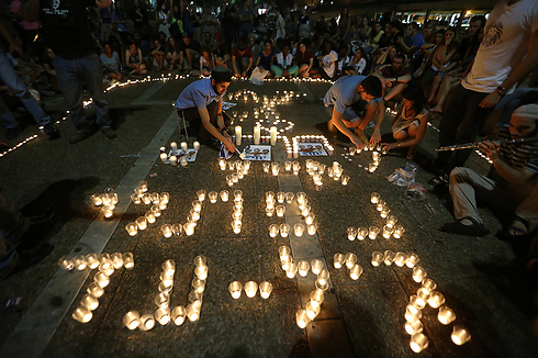 Names of murdered teens in candles (Photo: Yaron Brenner)