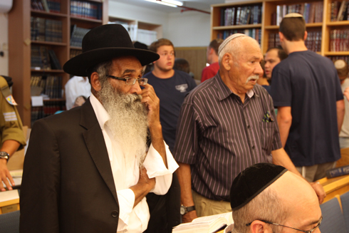 Eyal's grandfather (right) at the synagogue in Elad (Photo: Ido Erez) 