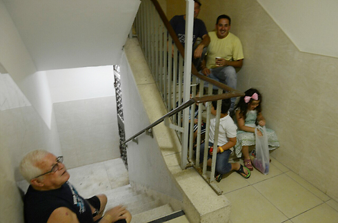 Familes in Ashdod hide from rockets (Photo: Avi Rokah)