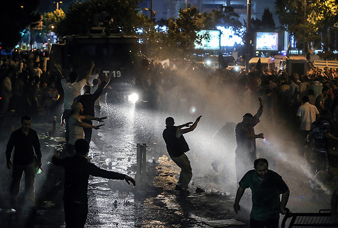 Police fire water cannons (Photo: AP)