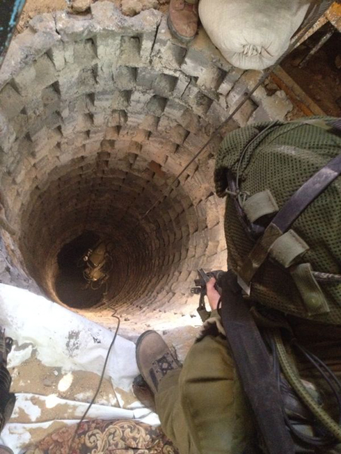 IDF soldiers looking into a terror tunnel in Gaza (Photo: IDF Spokesperson's Unit)