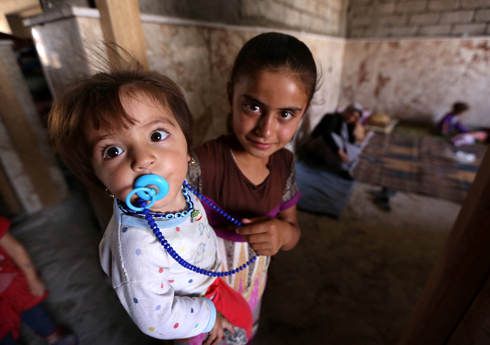 הערכה שמאות נערות ונשים יזידיות נכלאו ונפלו קורבן בידי דאעש (צילום: AFP)