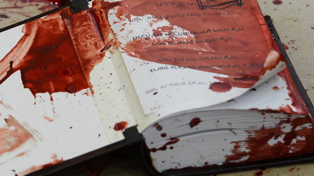 A bloodstained prayer book at the synagogue (Photo: GPO)