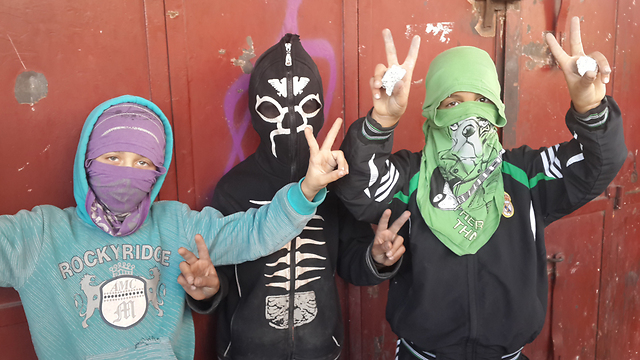 Masked Palestinian children who have joined riots in East Jerusalem. (Photo: Mohammed Shinawi)