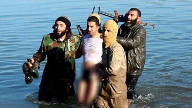 The Jordanian pilot being taken in by members of the Islamic State terrorist group. 