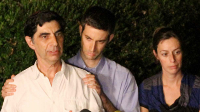 Hemi Goldin with his father and sister at the press conference following Hadar's kidnapping. (Photo: Ido Erez)