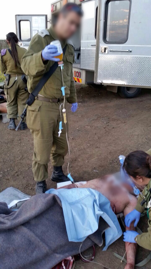 IDF soldiers treating wounded Syrians in Golan Heights (Photo: IDF Spokesperson's Unit)