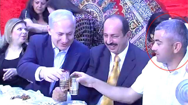 Electrician Avi Fahima sitting with Netanyahu