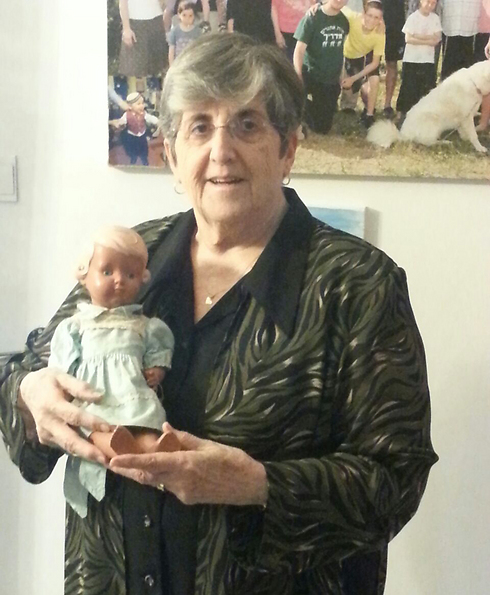 Tzipi Cohen and the doll that saved her life during the Holocaust (Photo: Shem Olam Institution)