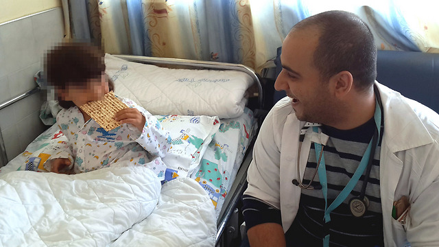The boy munching on his new favorite food (Photo: Ziv Medical Center)