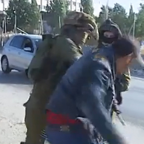 IDF to investigate video of IDF soldiers beating Palestinian