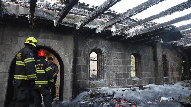 Firefighters at the damaged church (Photo: Avihu Shapira)