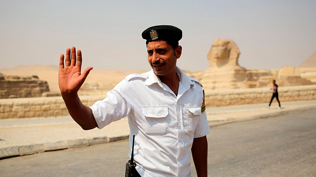 An Egyptian police officer near the pyramids (Photo: Reuters)