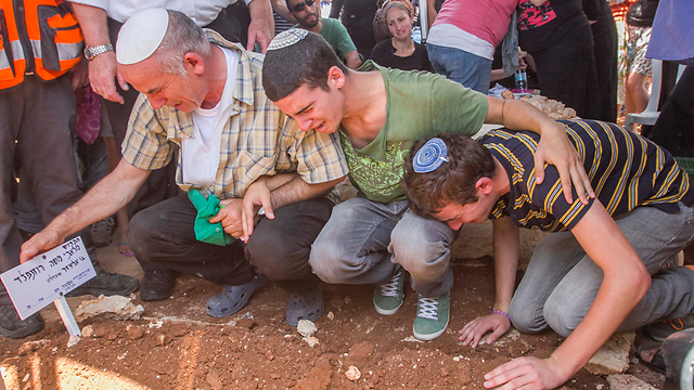 Eliezer Rosenfeld, among the signatories, seen at left at the funeral of his son, Malachi (Photo: Ido Erez)