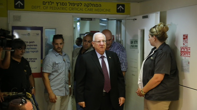 Rivlin visiting the Dawabsheh family at Tel HaShomer (Photo: Motti Kimchi)