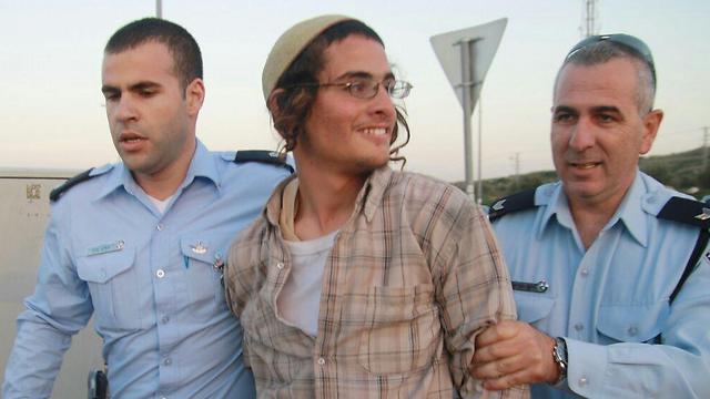 Ettinger in previous arrest (Archive photo: Ehud Amiton, Tazpit)