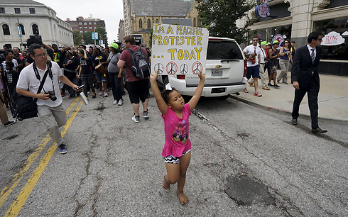 A little girl demonstrating against police violence in St. Louis, USA. (Photo: Reuters)
