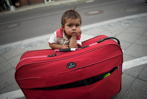 An immigrant boy waiting for his parents in Berlin. (Photo: Reuters)