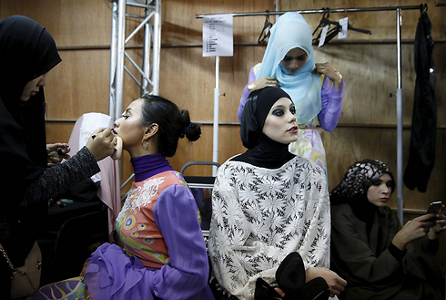 Models preparing for an Islamic fashion show in Malaysia. (Photo: Reuters)
