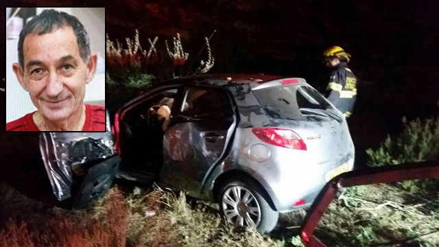 Alexander Levlolich and his wrecked vehicle at the scene of the attack. (Photo: Arik Abulof, Jerusalem Fire and Rescue)