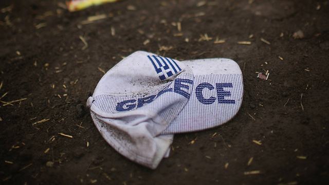 A baseball cap with Greek writing. Many refugees pass through Greece on their way to the northwestern parts of Europe. (Photo: Getty Images)