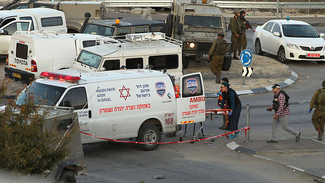 Evacuating the wounded after a recent West Bank terror attack (Photo: AFP)