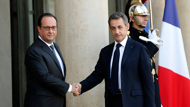 French President Francois Hollande and former president Nicolas Sarkozy on Sunday (Photo: EPA)