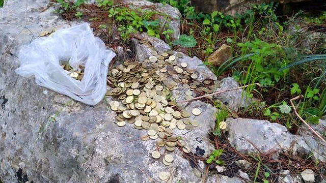 Buried treasure: two suspects stole charity boxes from West Bank synagogues and buried them in a forest. (Photo: Police Spokesperson)