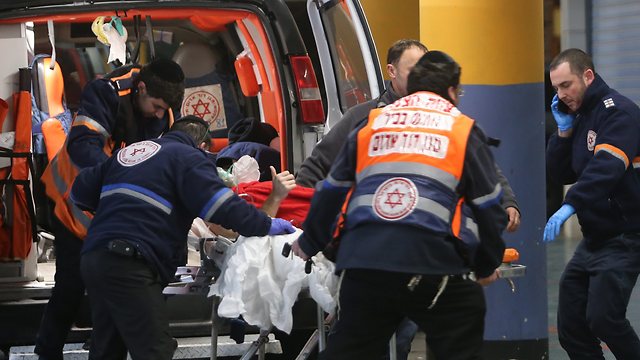 The victim being taken to Shaare Zedek medical center (Photo: Alex Kolomoisky)