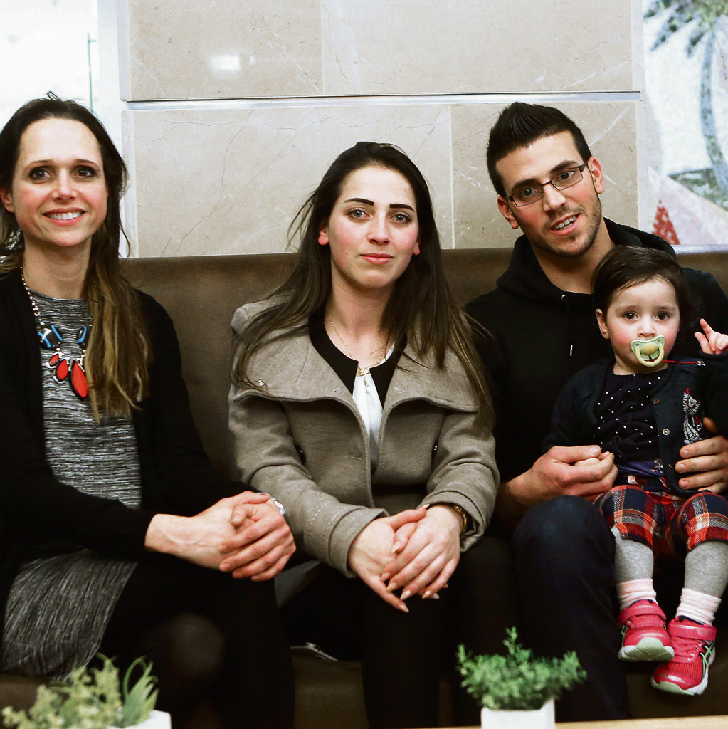 Rinal Seif (center) with younger brother Kinan and her baby. At left: Shabbat host Tova