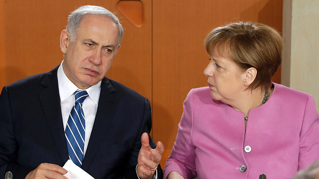 Netanyahu meets with German Chancellor Merkel in Berlin (Photo: AFP)