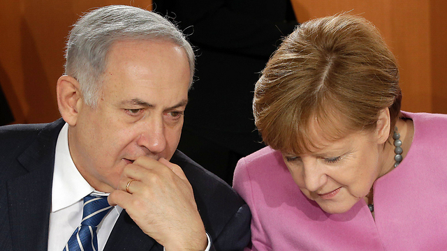 Netanyahu and Merkel meet in Berlin (Photo: AFP)