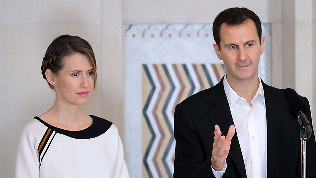 Syrian President Bashar al-Assad with his wife Asma. 'The six difficult years are already behind us' (Photo: EPA)