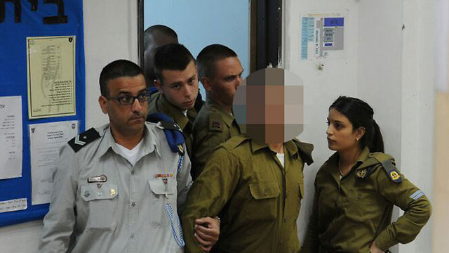 Soldier led in handcuffs to the military court (Photo: Avi Rokach)