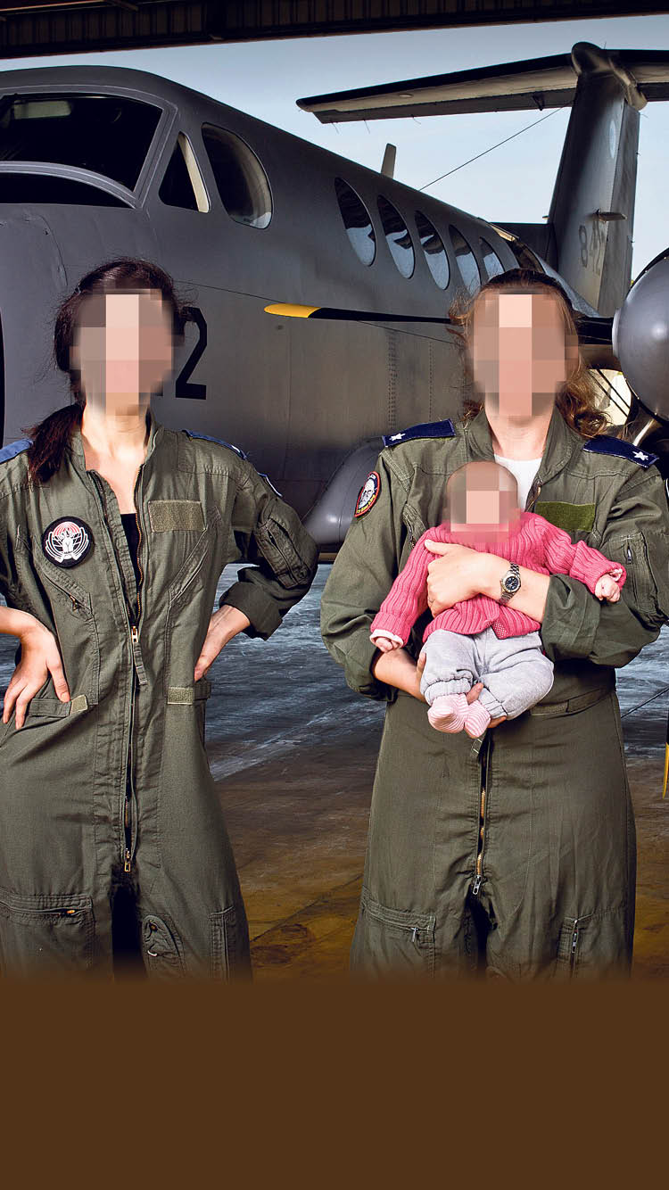 Air Force pilots with a baby