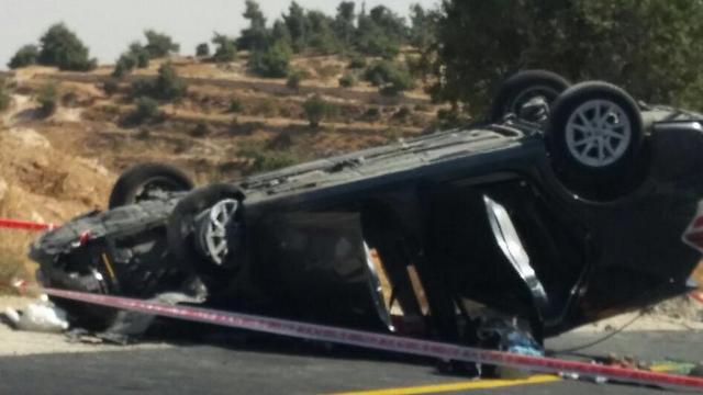 The Marks' flipped car (Photo: Har Hevron Regional Council) 