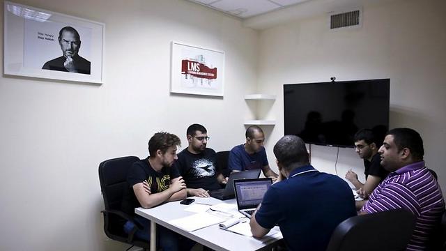 Firas Jabbour (C), founder and CEO of start-up Edunation, a social-learning platform, meets with his team at their offices in Nazareth (Photo: Reuters) (Photo: Reuters)