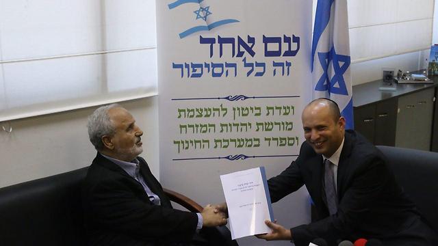 Commission chair Erez Biton submitting recommendations to Education Minister Bennett (Photo: Motti Kimchi)