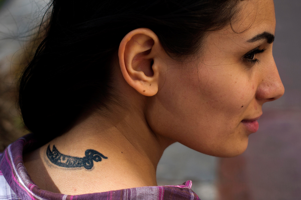Farah Najm with her tattoo of Ali's sword (Photo: AP)