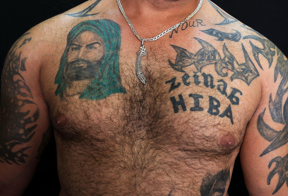 Tattoos for Imam Ali and his daughter Zeinab (Photo: AP)