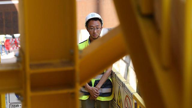 One of the Chinese foreign workers on the project (Photo: Motti Kimchi)
