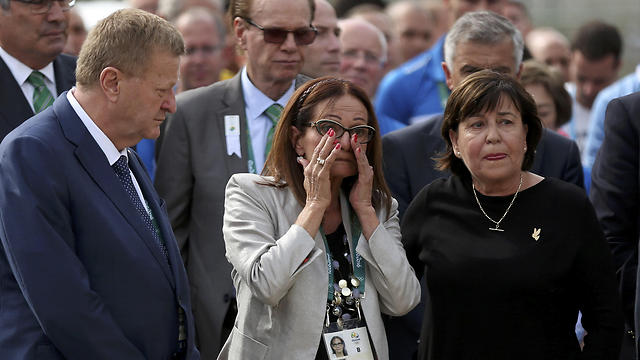Ilana Romano, center, and Ankie Spitzer, right, widows of Israeli Olympic athletes killed at the 1972 Munich Olympics, attend a memorial in their husbands' honor, ahead of the Summer Olympics in Rio de Janeiro (Photo: AP)