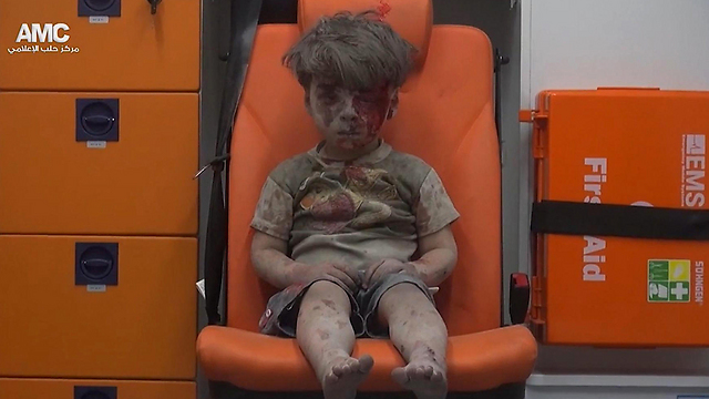 The shocking image of five-year-old Omran at the back of an ambulance (Photo: AP) (Photo: AP)