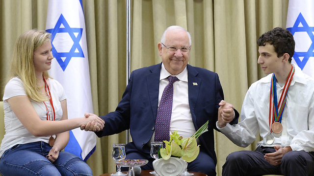 Israeli President Rivlin with the silver and bronze medal winners of the chemistry olympiad in Georgia (Photo: Mark Neiman)