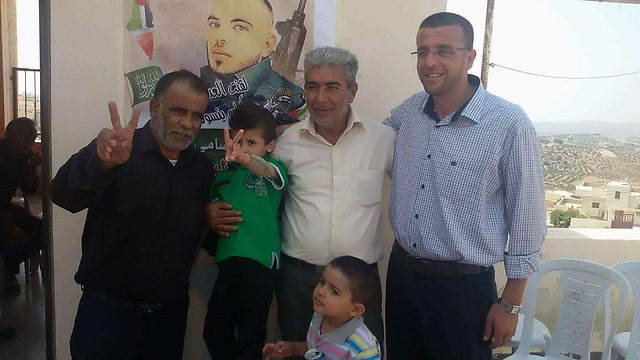 Ahmed Dawabsheh and his grandfather visiting Hebron terrorist's home