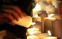 Lighting memorial candles for Eldad Regev and Ehud Goldwasser (Photo: AP)
