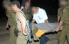 Injured soldiers being evacuated from scene of the accident