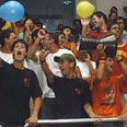 Enthusiastic crowd cheers on during b-ball game